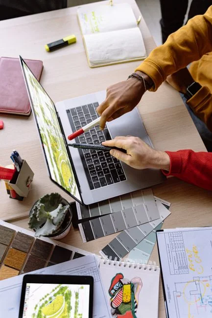 Person shopping online using a laptop and credit card, highlighting e-commerce convenience.